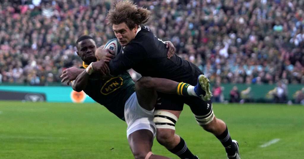 A dynamic shot of Ethan Blackadder facing off against the Springboks.